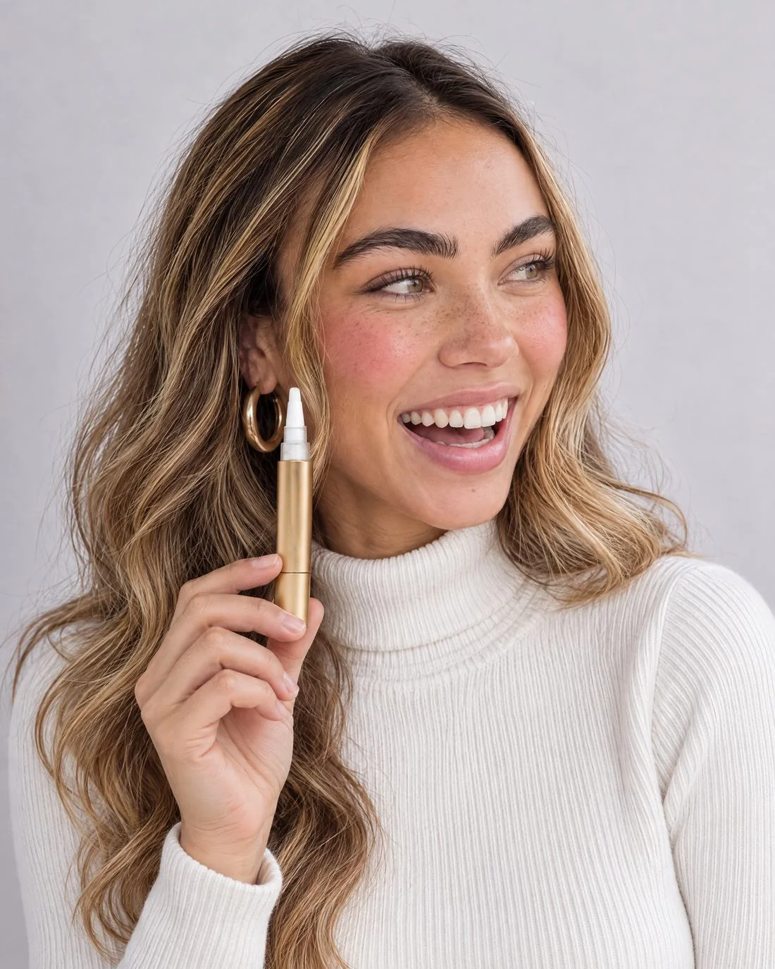Laughing, holding the Gold Pen